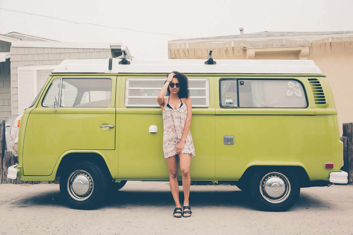 girl in front of a minibus